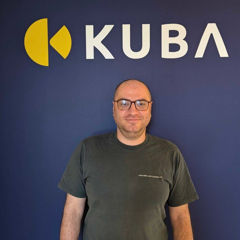 Salar standing in front of the kuba logo