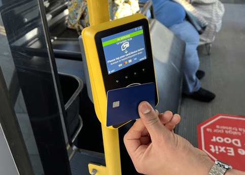 Passenger using credit card to Tap2Pay on Monterey-Salinas Transit validator.