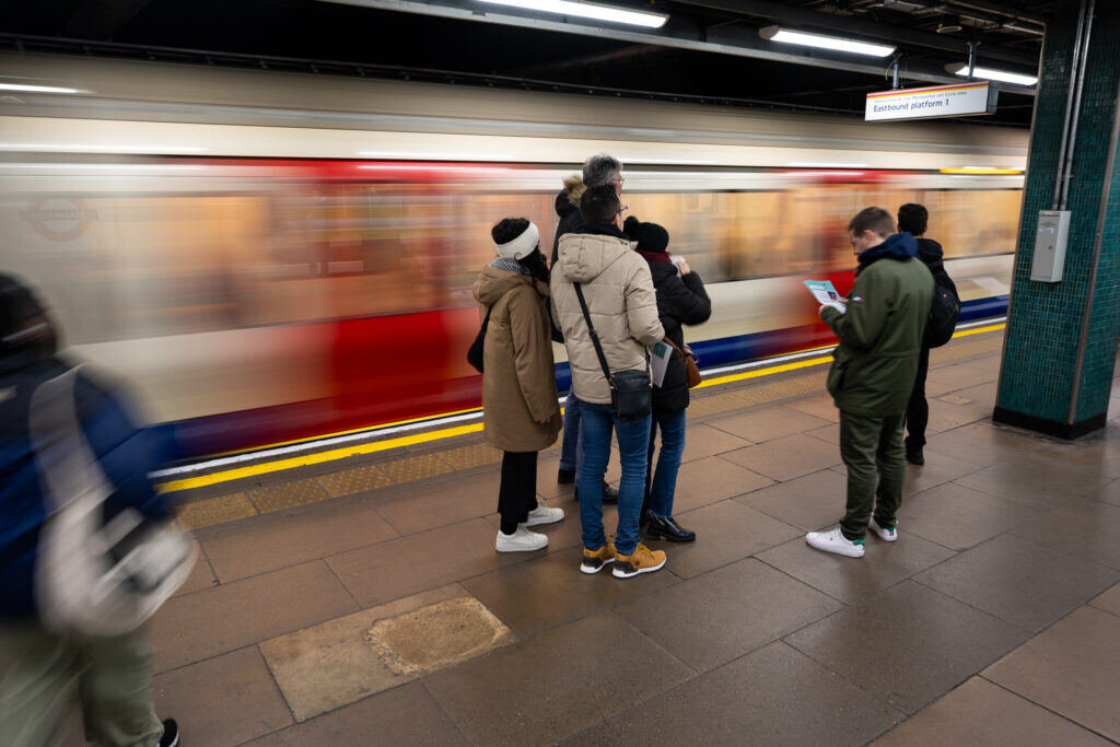 group of people waiting for a metro